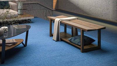 BDI Kava walnut bench on blue carpet with dino coffee table GALLERY