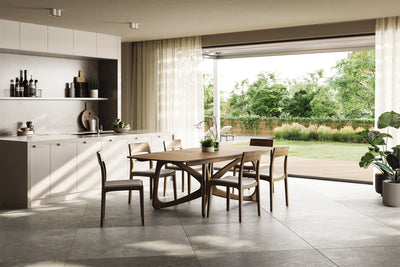 Natural Walnut Table Open with Chairs accented by green foliage GALLERY