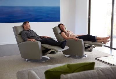 American Leather Comfort Recliner Elliot Relaxing Husband and Wife in bright Room GALLERY