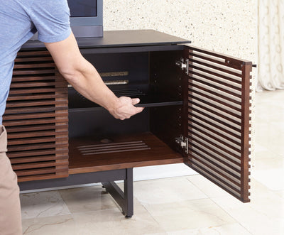 Setting an adjustable shelf in the right facing cabinet