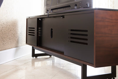 Exterior view of rear panels on media unit showing ventilation and wire management access in all cabinets
