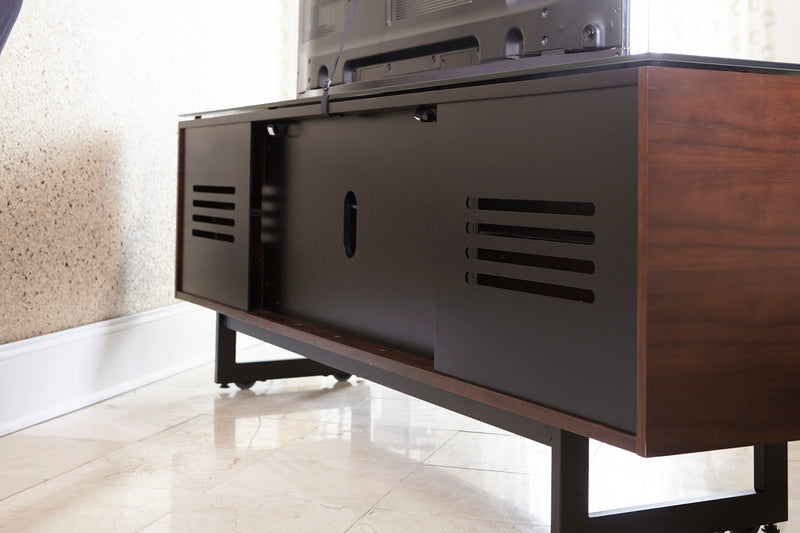 Exterior view of rear panels on media unit showing ventilation and wire management access in all cabinets