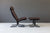 Siesta Chair Black Oak Frame with Chocolate Brown leather on  white ground with grey horizon GALLERY