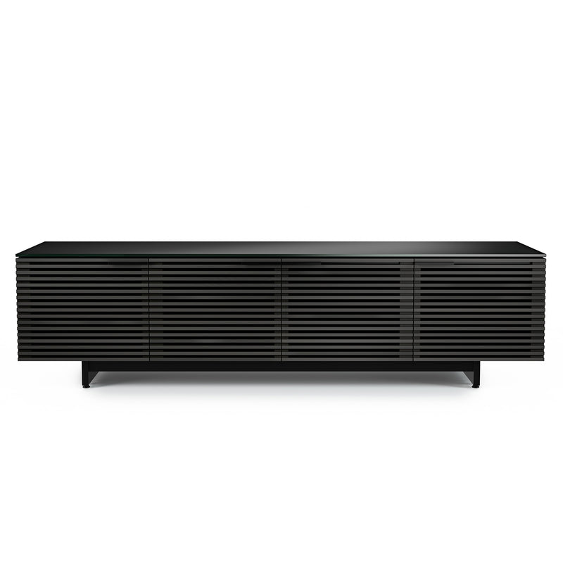 BDI Corridor 8173 low media tv stand with horizonal slatted doors made of charcoal stained ash topped with a black glass finish